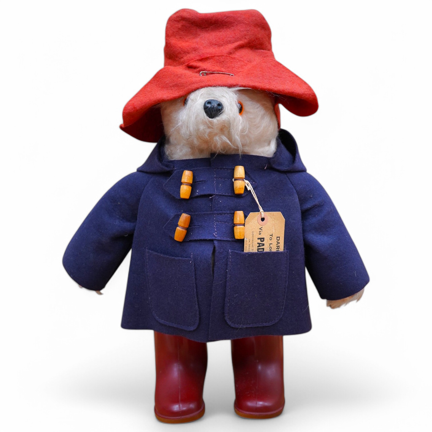 A Paddington bear with clothing and tag, 50cm high. Condition - good